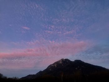 Scenic view of silhouette mountain against sky during sunset