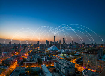 Digital composite image of buildings with connecting dots in city