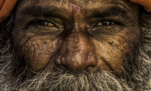 Close-up portrait of senior beggar