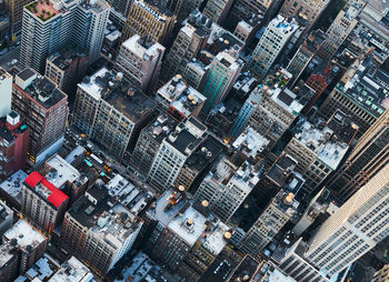 Inclined shot of new york city rooftops from above at sunset