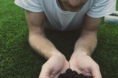 Close-up of man holding fruits