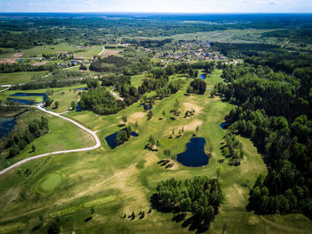 High angle view of golf course against sky