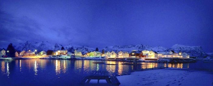 Illuminated city at waterfront