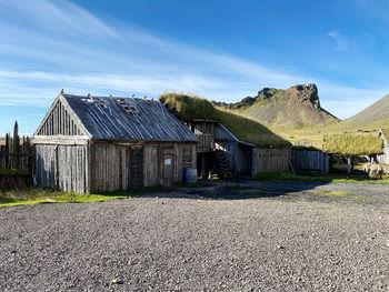 Old town wooden house farm blue sky in iceland lord of the rings mountain sunny day door and window 