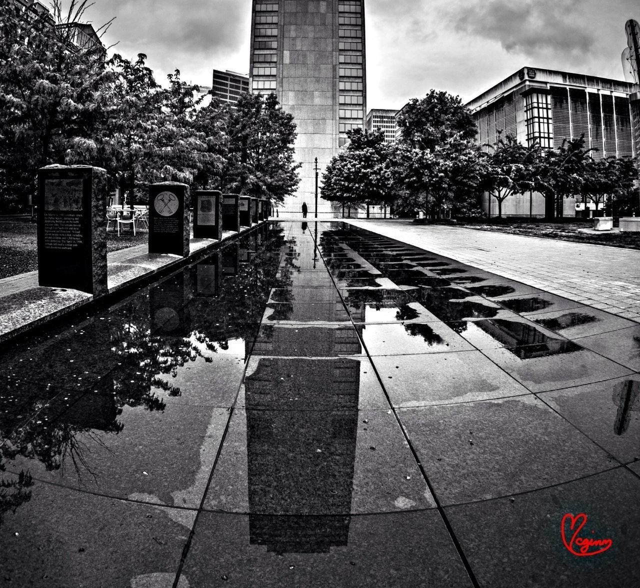 architecture, building exterior, built structure, city, tree, sky, building, paving stone, the way forward, street, day, reflection, cobblestone, sidewalk, cloud - sky, outdoors, incidental people, footpath, diminishing perspective, sunlight