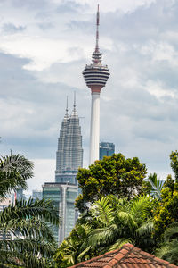 View of modern building against cloudy sky