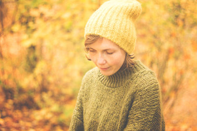 Close-up of smiling woman in warm clothes outdoors