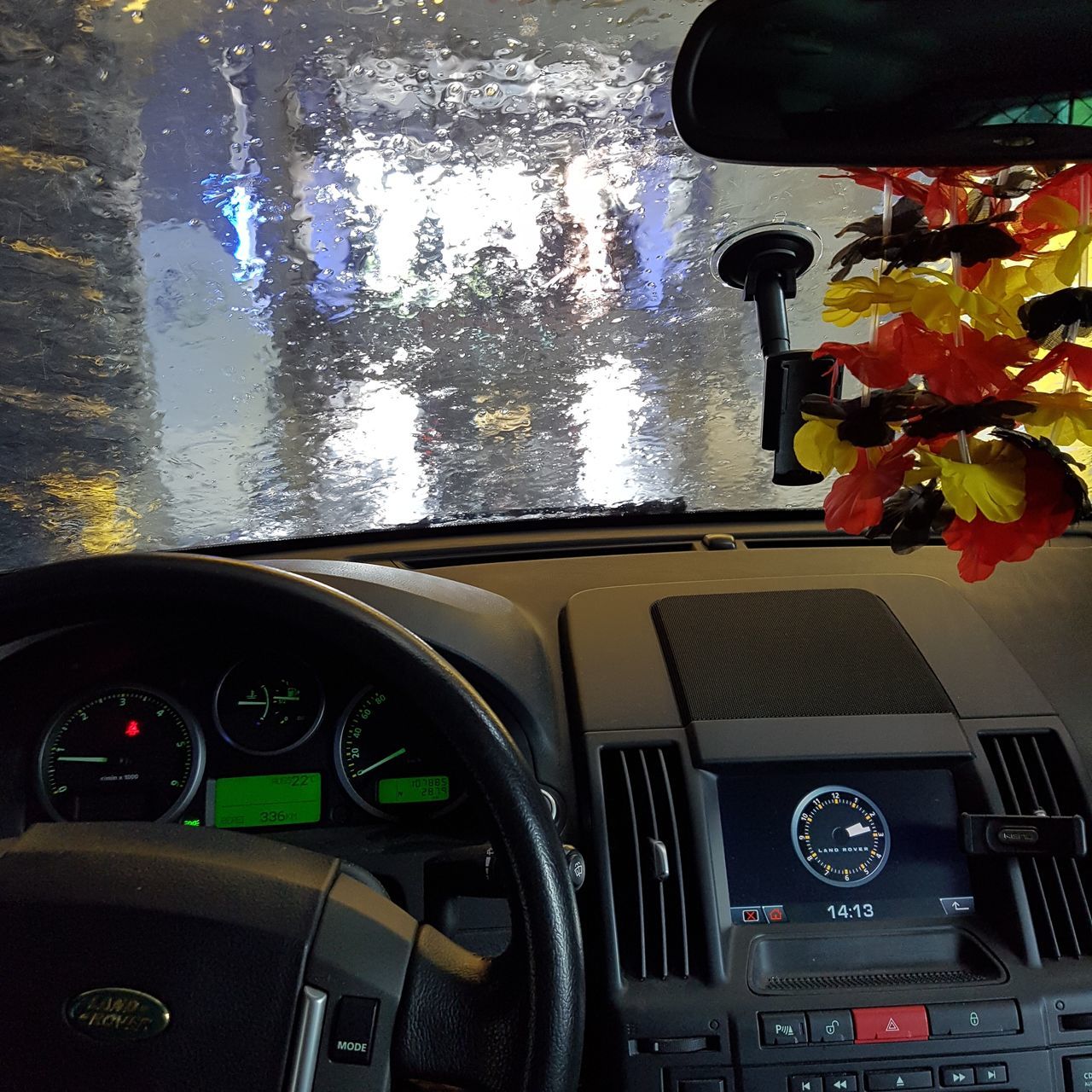 REFLECTION OF CAR ON STREET