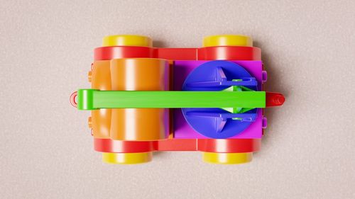 Close-up of multi colored toy against colored background