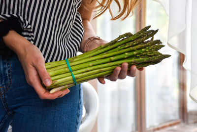 Midsection of woman holding ice cream