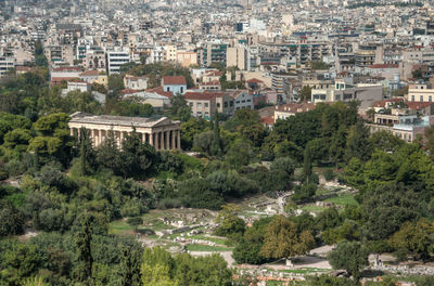 High angle view of houses and trees in city