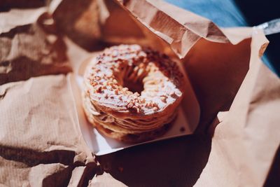 High angle view of paris-brest on paper