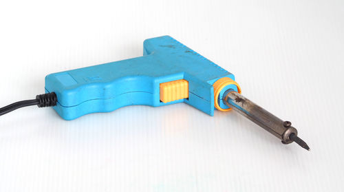 High angle view of telephone on table against white background