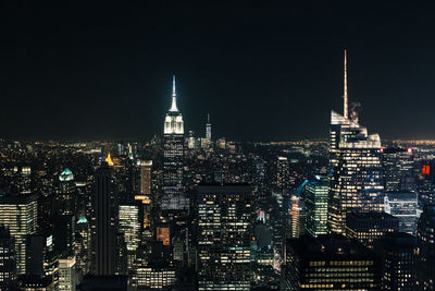 Illuminated buildings in city at night