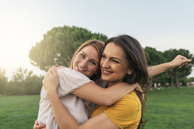 Happy lesbian couple enjoying at park