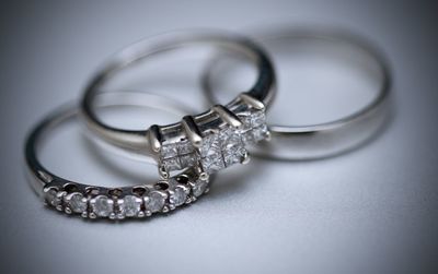 Close-up of diamond rings on table