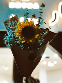 Close-up of illuminated flower vase on table