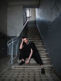 Young woman on staircase