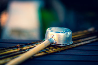 Close-up of old tea cup on table