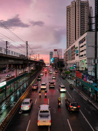 Traffic on city street during sunset