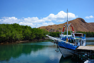 Boats moored in bay
