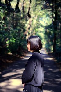 Rear view of woman standing in forest japanese girl 