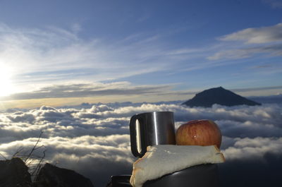 Close-up of food against sky during sunset