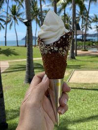 Midsection of person holding ice cream