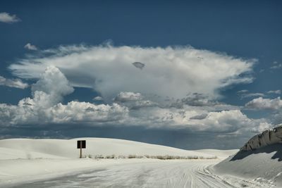 Scenic view of snow covered landscape against sky