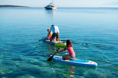 Man kayaking in sea