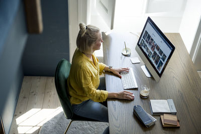 Woman in office using computer