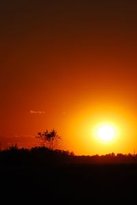 Scenic view of silhouette landscape against romantic sky at sunset