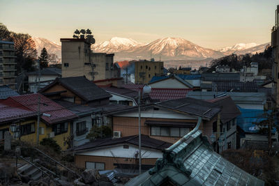 Aerial view of shibu onsen town and central alps mountain at sunrise, yamanouchi, nagano, japan.