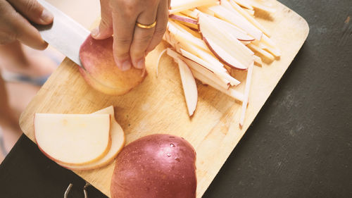 High angle view of person preparing food on cutting board