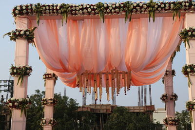 Panoramic view of temple hanging outside building against sky