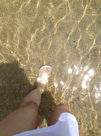 High angle view of woman standing on beach