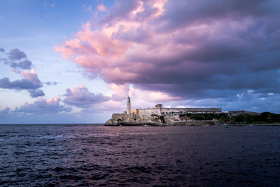 Scenic view of sea against sky at sunset