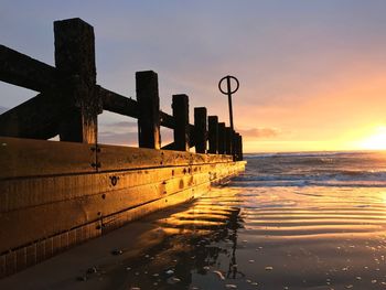 Scenic view of sea against sky at sunset