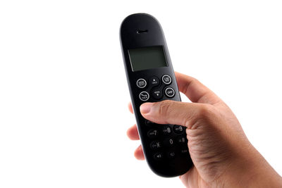 Midsection of person using smart phone against white background