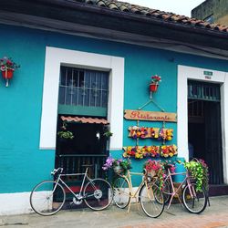 Bicycles parked against building in city