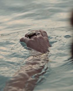 Close-up of man swimming in water