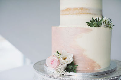 Close-up of rose flower pot on table