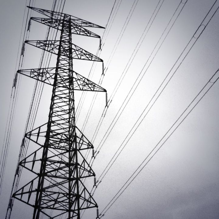 power line, electricity pylon, electricity, power supply, low angle view, connection, cable, fuel and power generation, technology, sky, power cable, clear sky, complexity, electricity tower, silhouette, outdoors, no people, day, built structure, tall - high