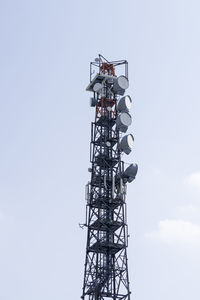 Low angle view of communications tower against clear sky