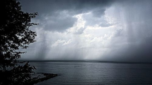 Scenic view of sea against cloudy sky