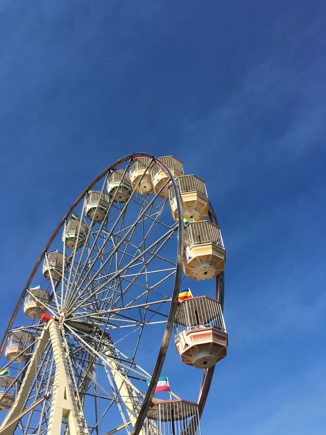 Ferris wheel set against clear blue sky