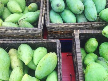 High angle view of apples in basket for sale