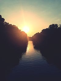 Scenic view of sunset over river