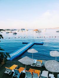 High angle view of sailboats in sea against sky