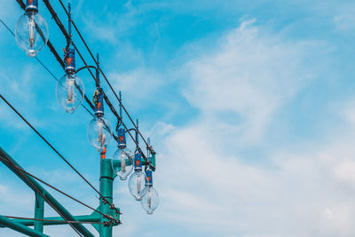 Low angle view of ferris wheel against sky